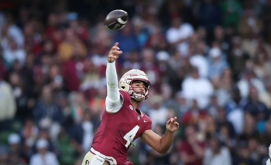 Florida State quarterback DJ Uiagalelei passes the ball against Georgia Tech. The Seminoles are among the teams highlighted in our college football predictions for Week 1.
