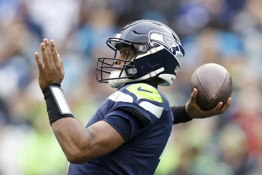 Geno Smith of the Seattle Seahawks passes during the first quarter against the Carolina Panthers at Lumen Field on December 11, 2022 in Seattle, Washington.