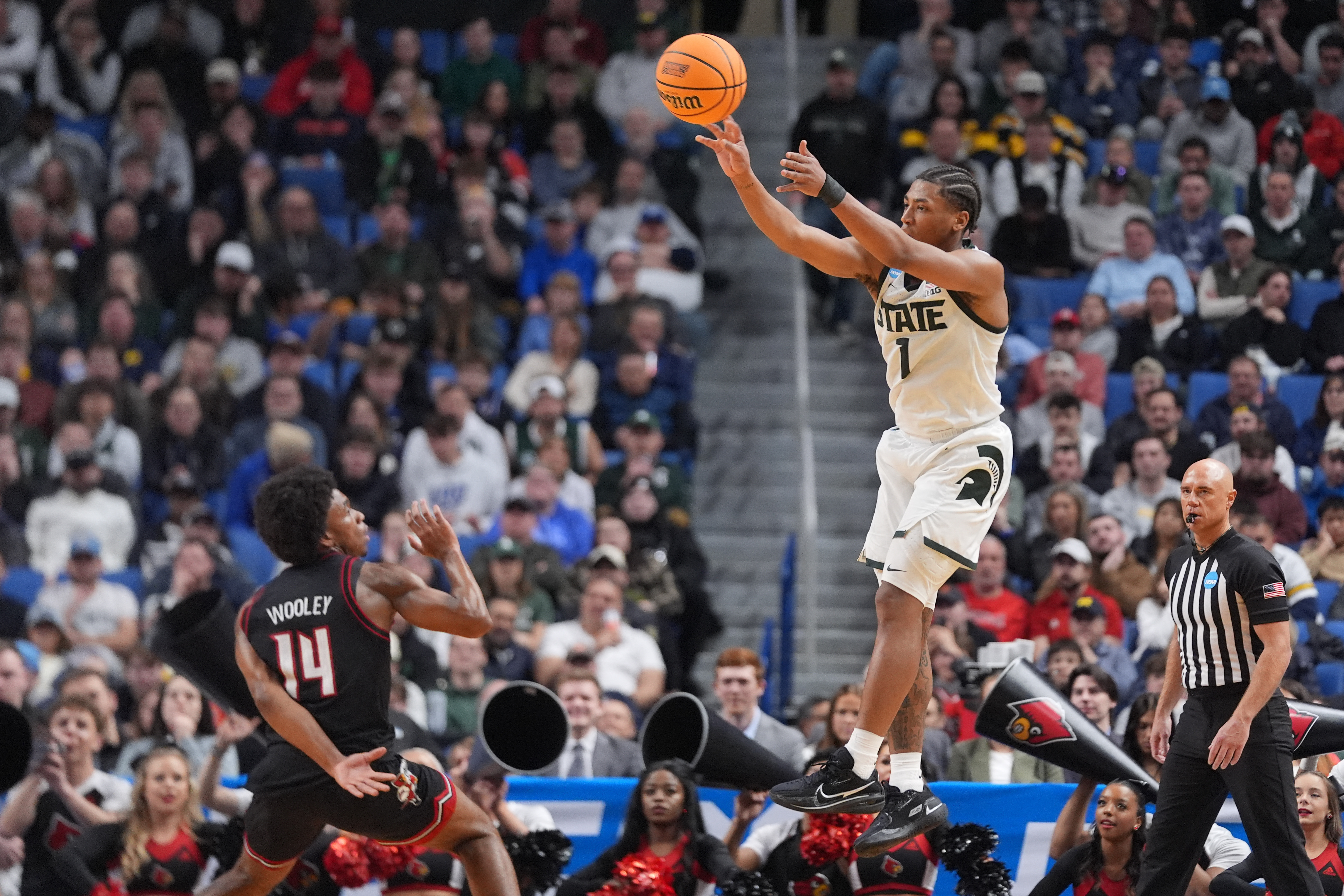 Jeremy Fears Jr. passes the ball as we offer our Michigan State vs. UConn prediction and parlay. 
