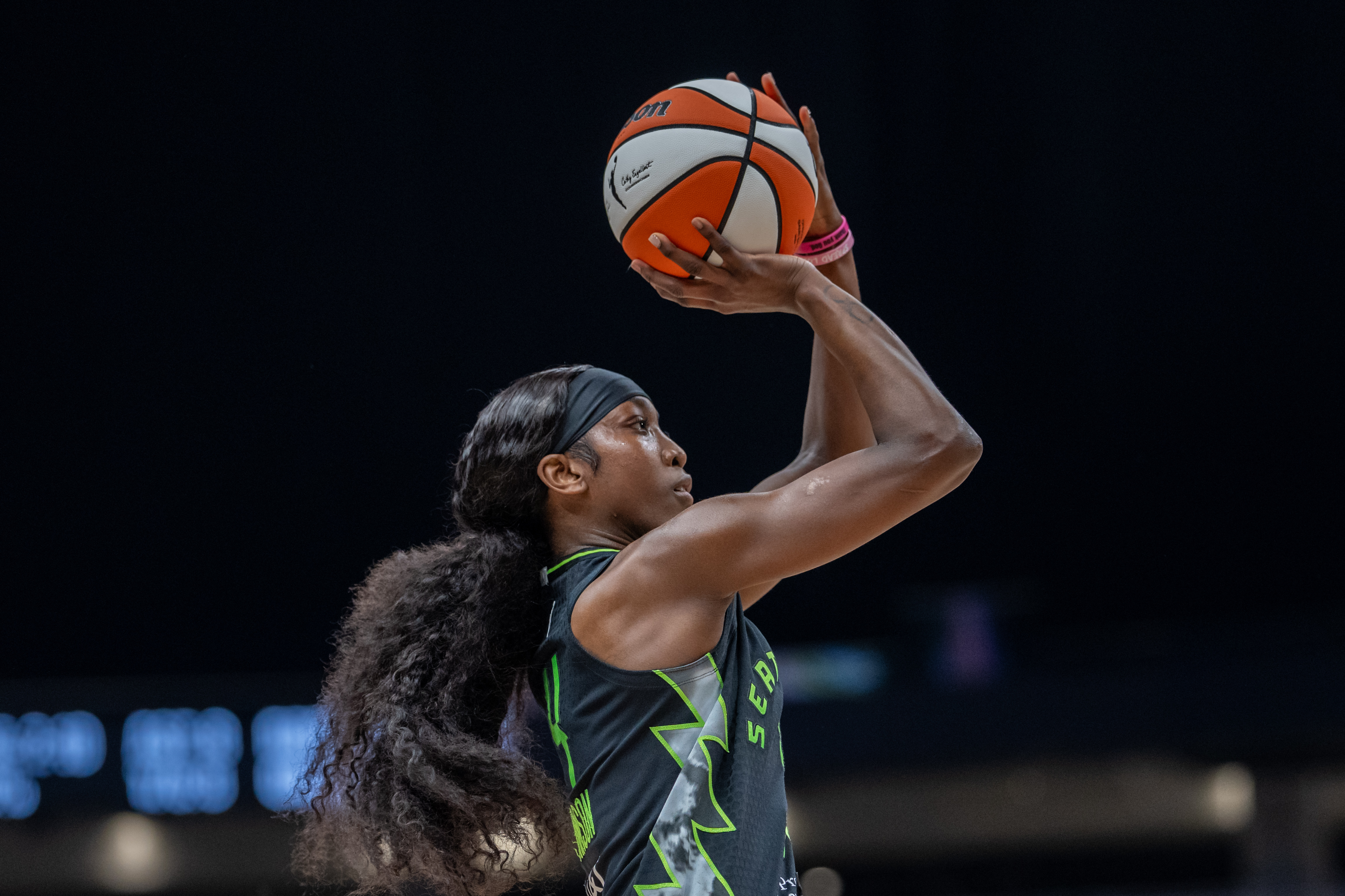 Seattle Storm guard Flau'jae Johnson (4) shoots the ball as she is featured in our Storm vs. Dream prediction.