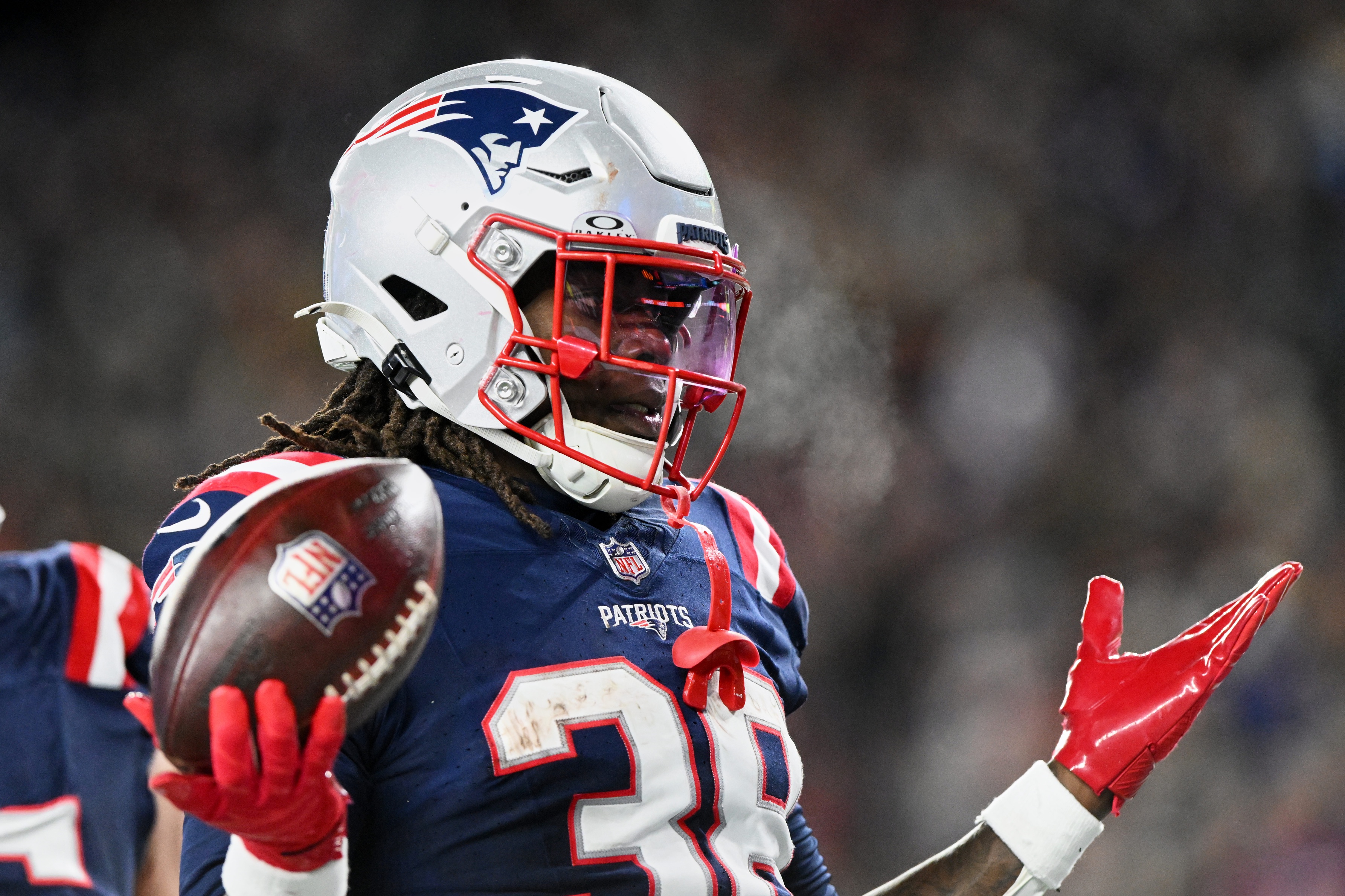  New England Patriots running back Rhamondre Stevenson (38) acknowledges the crowd after scoring a touchdown against the Miami Dolphins during the fourth quarter at Gillette Stadium. 