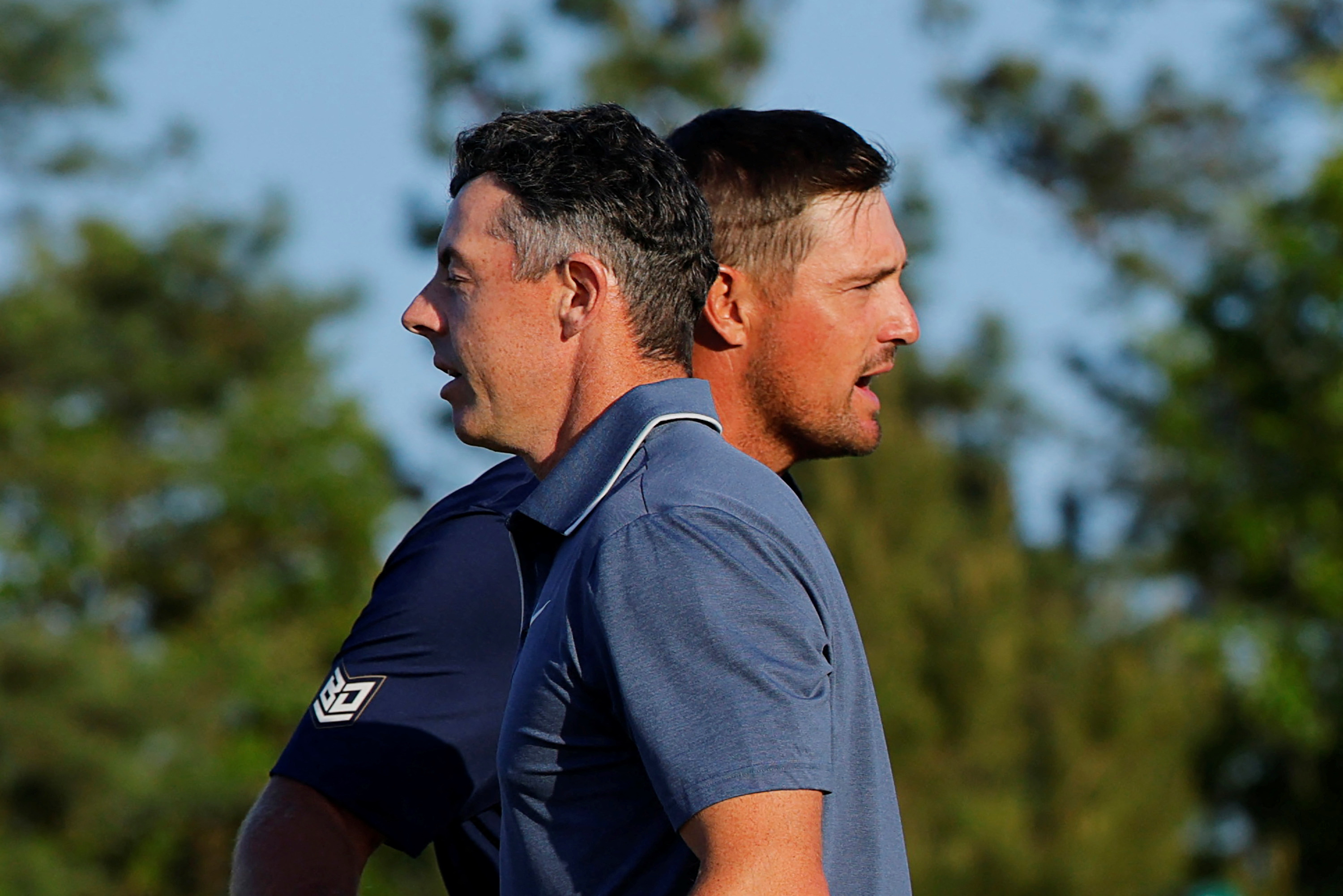 Rory McIlroy shakes hands with Bryson DeChambeau on the green of the 18th hole after completing their final round as we look at our Masters power rankings