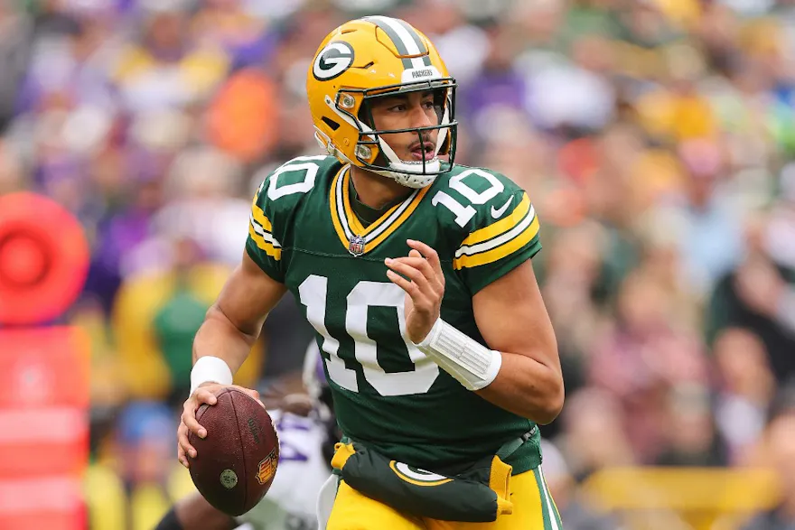 Jordan Love #10 of the Green Bay Packers looks to pass as we round up our NFL predictions for Week 14