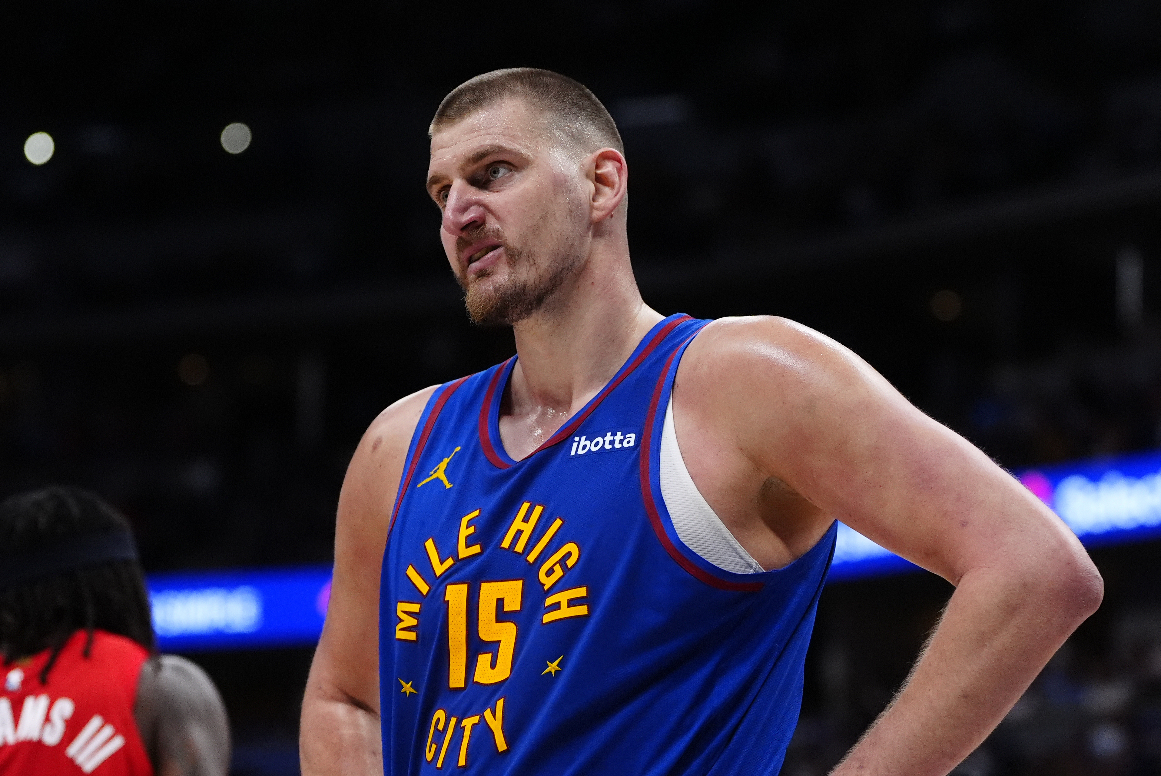 Denver Nuggets center Nikola Jokic (15), seen here looking on during a game, is featured in our Nuggets vs. Suns player props today.