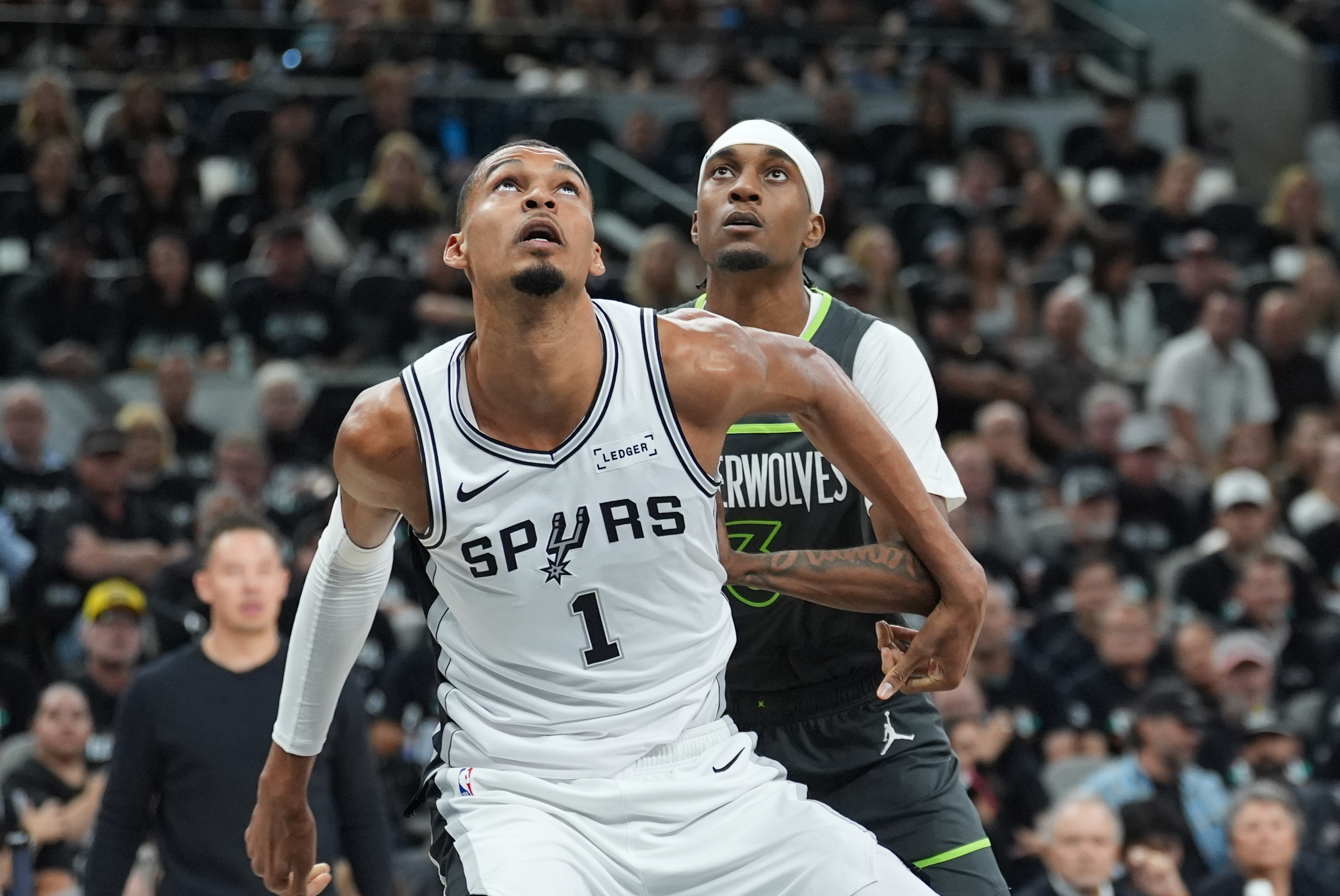 San Antonio Spurs forward Victor Wembanyama (1) blocks out Minnesota Timberwolves forward Jaden McDaniels (3) as we offer our best Spurs vs. Timberwolves player props today for Game 3.