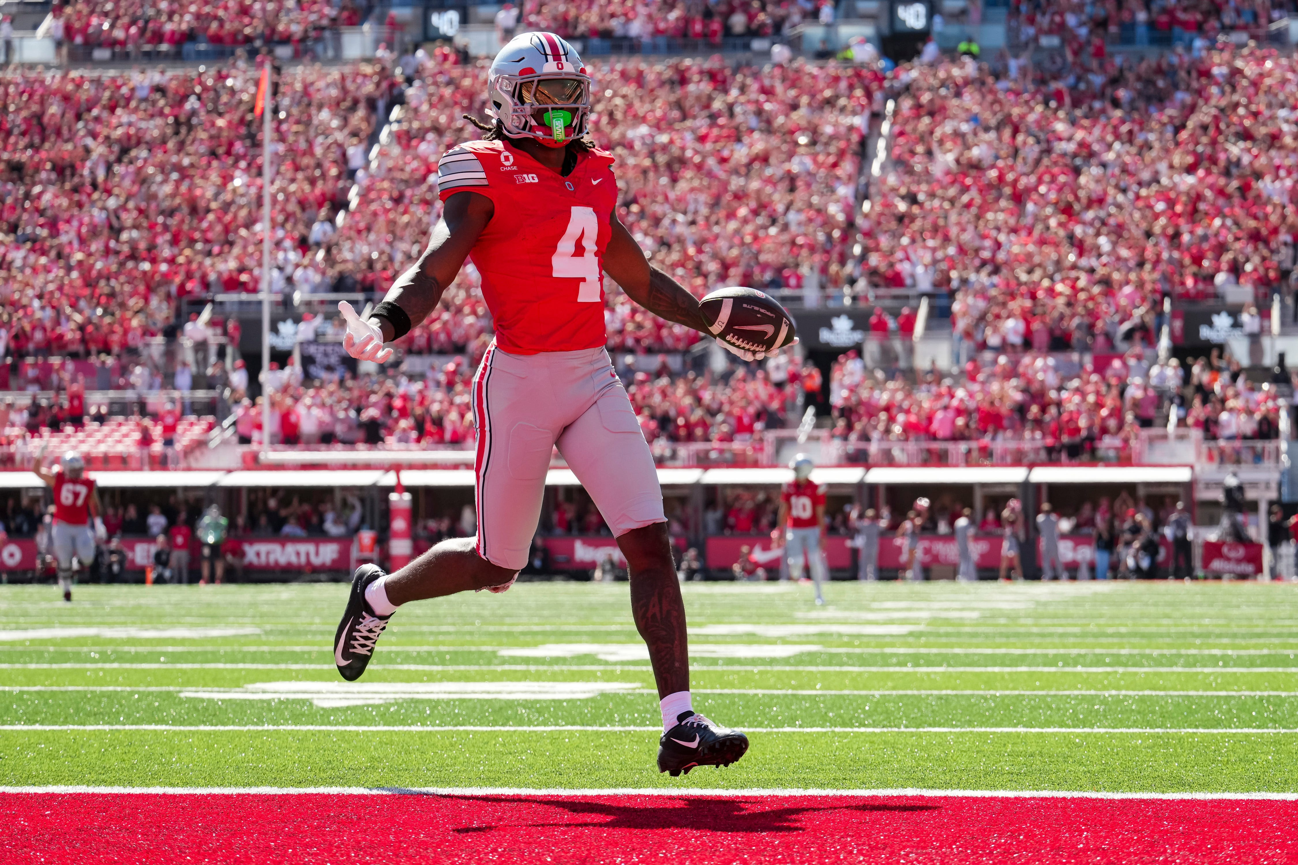 Ohio State Buckeyes wide receiver Jeremiah Smith scores a touchdown as we make our best Ohio State vs. Iowa same-game parlay
