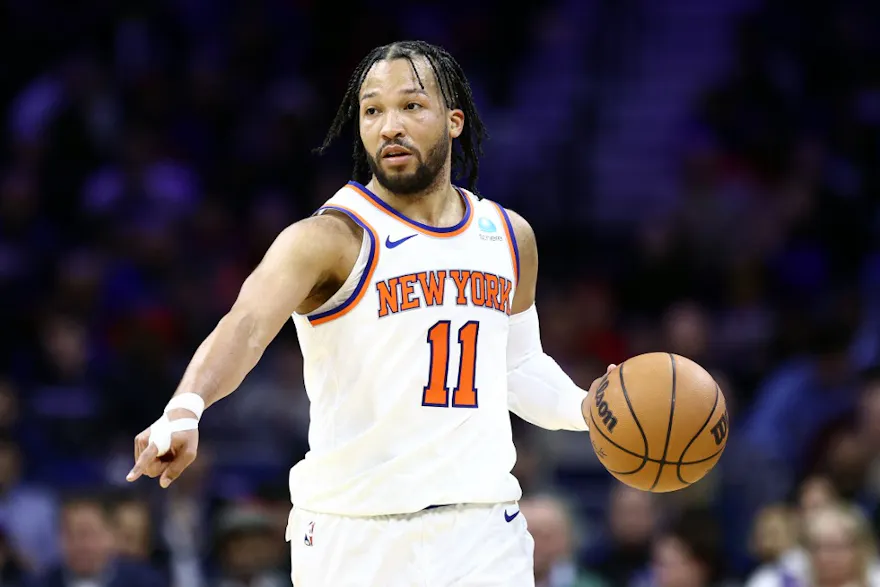 Jalen Brunson of the New York Knicks dribbles during the third quarter against the Philadelphia 76ers at the Wells Fargo Center as we look at our 76ers-Knicks predictions.