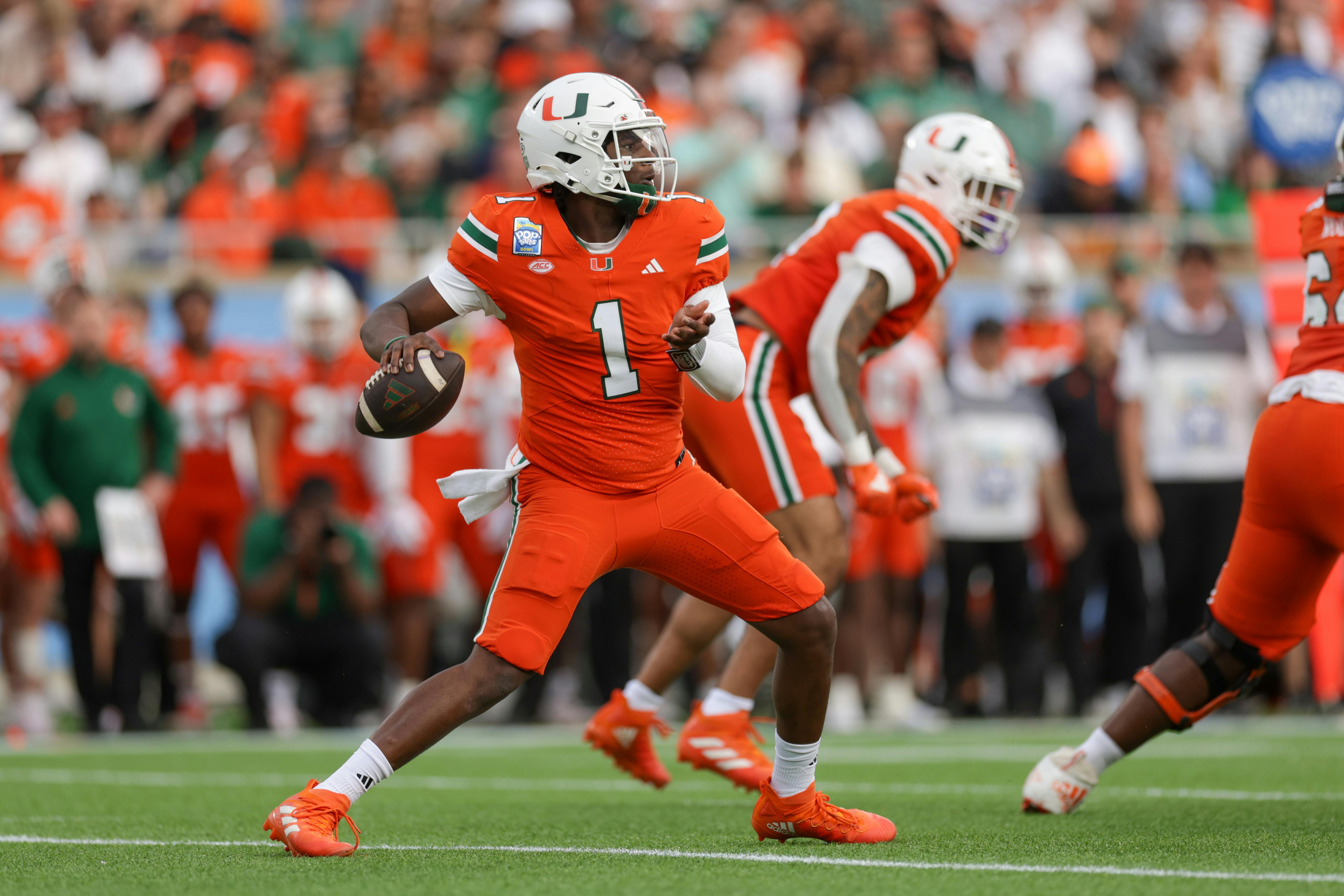 Miami Hurricanes quarterback Cam Ward drops back to pass as we examine the 2025 NFL Draft odds and who will be the No. 1 overall pick.