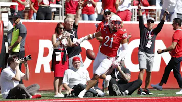 Karene Reid of the Utah Utes scores a touchdown on an interception against the UCLA Bruins, and we offer our exclusive BetRivers promo code for Utah vs. Oregon State.