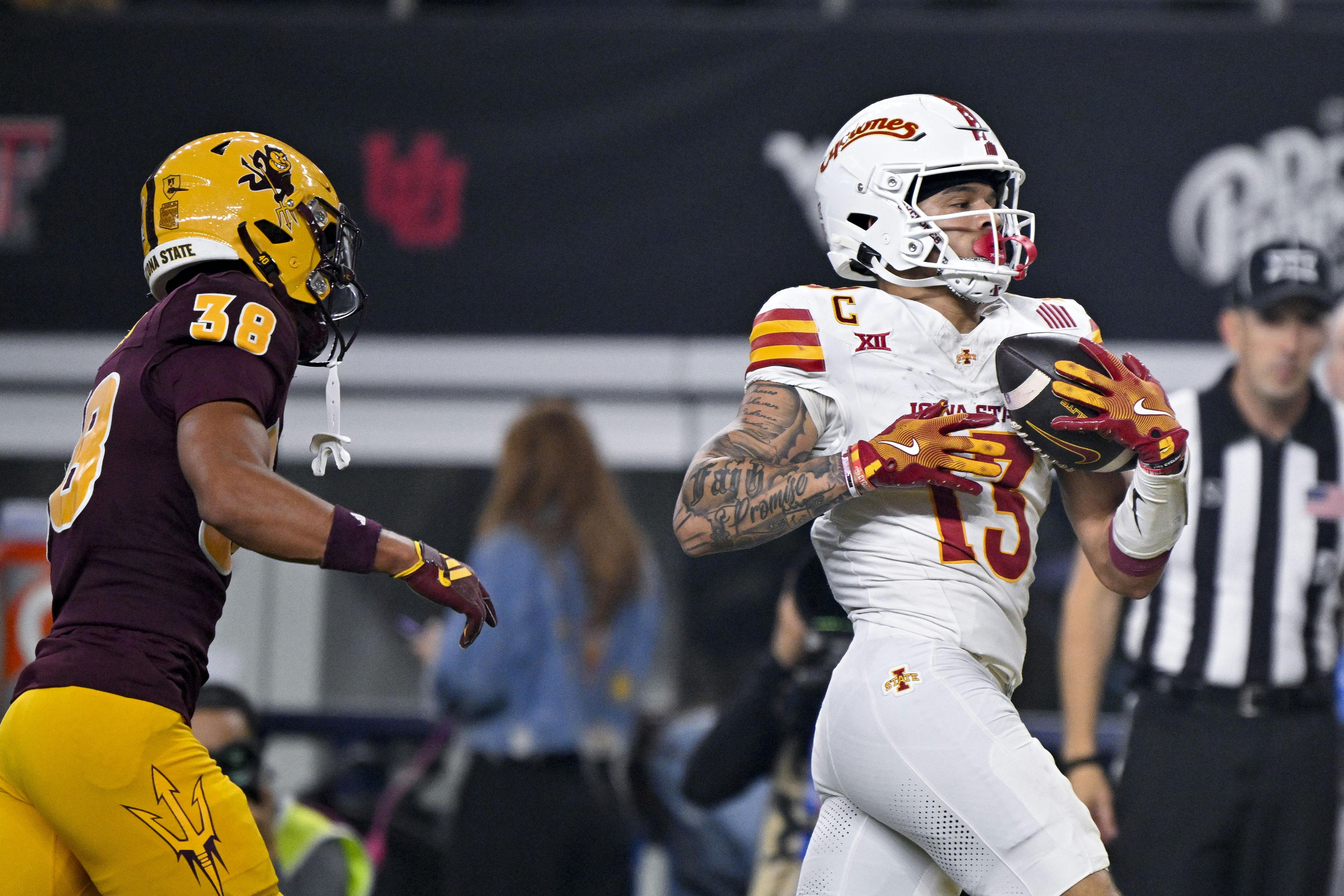 Iowa State wide receiver Jaylin Noel catches a pass for a touchdown against Arizona State. The Cyclones play Miami as part of our college football bowl game odds coverage.