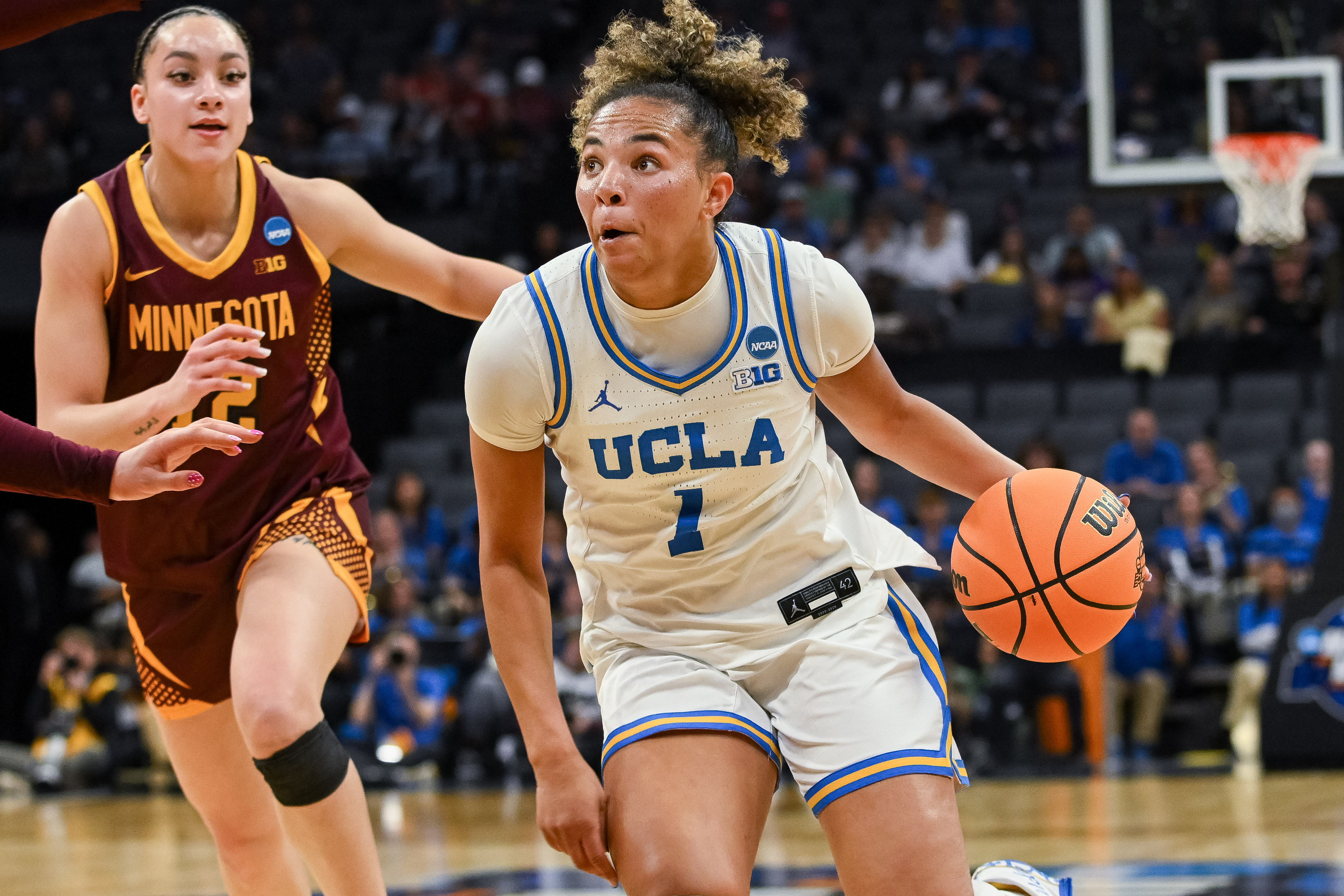 UCLA Bruins guard Kiki Rice drives against the Minnesota Golden Gophers, and we're backing her team to cover as the favorite with our Duke vs. UCLA prediction.