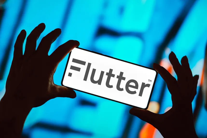 The Flutter Entertainment logo is displayed on a smartphone as we look at Vixio's new Chairman of the Board.
