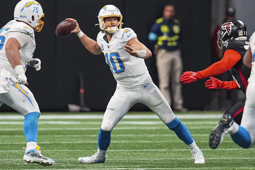 Los Angeles Chargers quarterback Justin Herbert passes the ball against the Atlanta Falcons as we offer our Justin Herbert SNF player prop bets.