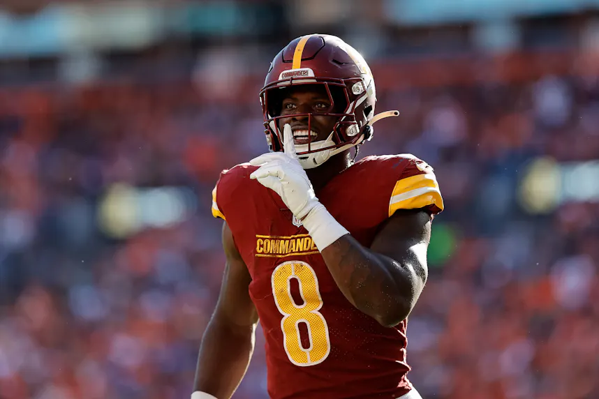 Washington Commanders running back Brian Robinson Jr. reacts after scoring a touchdown in the fourth quarter against the Denver Broncos as we look at our NFL predictions and best bets for Week 4.