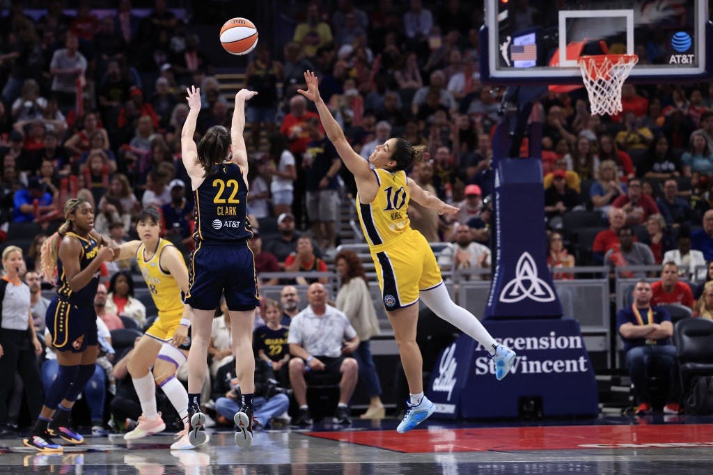 Caitlin Clark (22) of the Indiana Fever attempts a shot against Kia Nurse (10) of the Los Angeles Sparks at Gainbridge Fieldhouse on May 28, 2024 in Indianapolis.