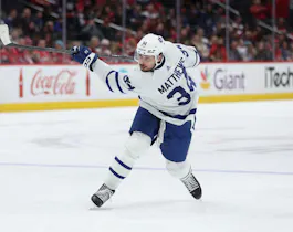 Auston Matthews #34 of the Toronto Maple Leafs shoots the puck against the Washington Capitals as we make our Devils vs. Maple Leafs player props predictions for Tuesday. 
