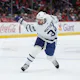 Auston Matthews #34 of the Toronto Maple Leafs shoots the puck against the Washington Capitals as we make our Devils vs. Maple Leafs player props predictions for Tuesday. 