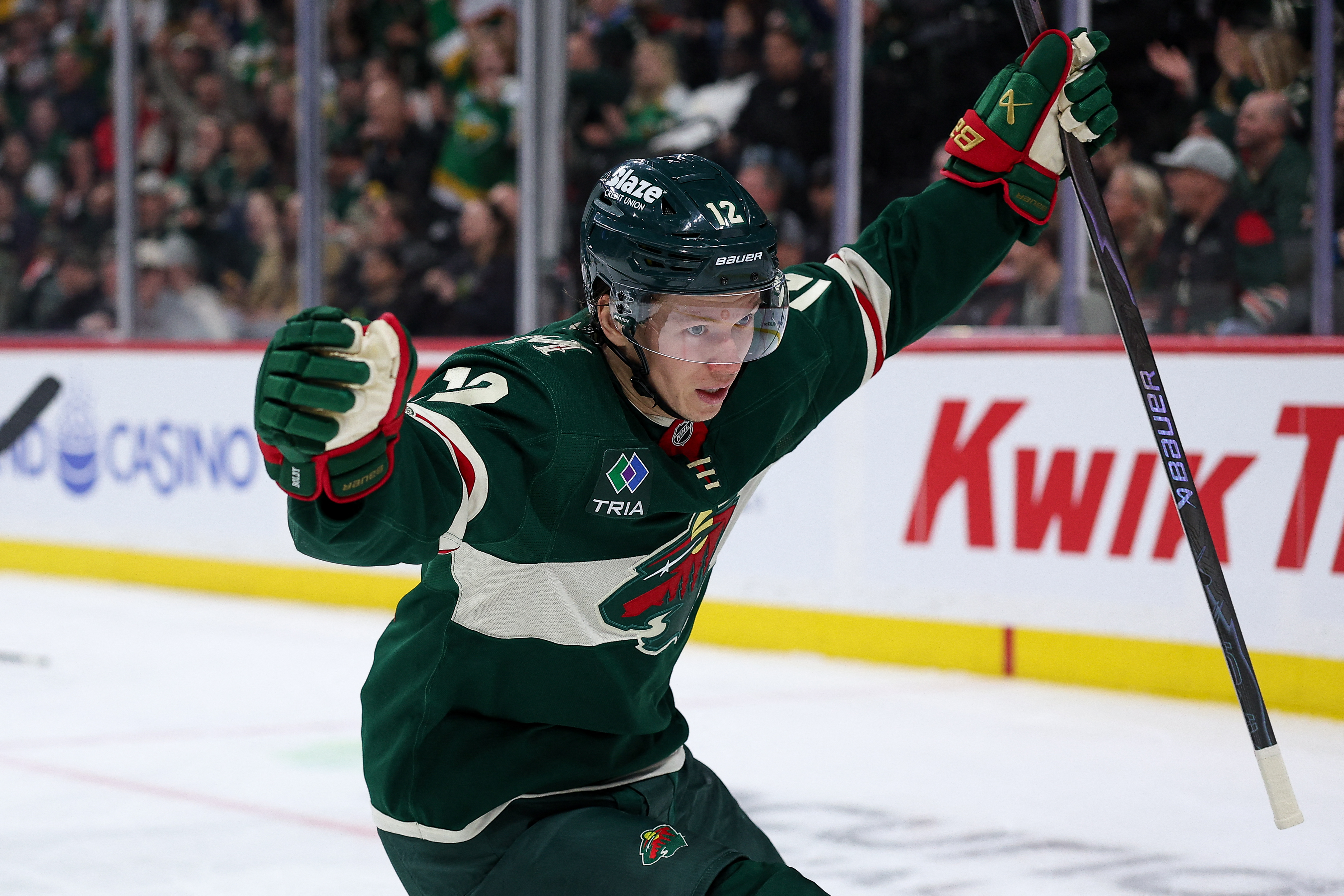 Minnesota Wild left wing Matt Boldy (12), seen here celebrating during a game, is featured in our NHL anytime goal scorer predictions tonight.
