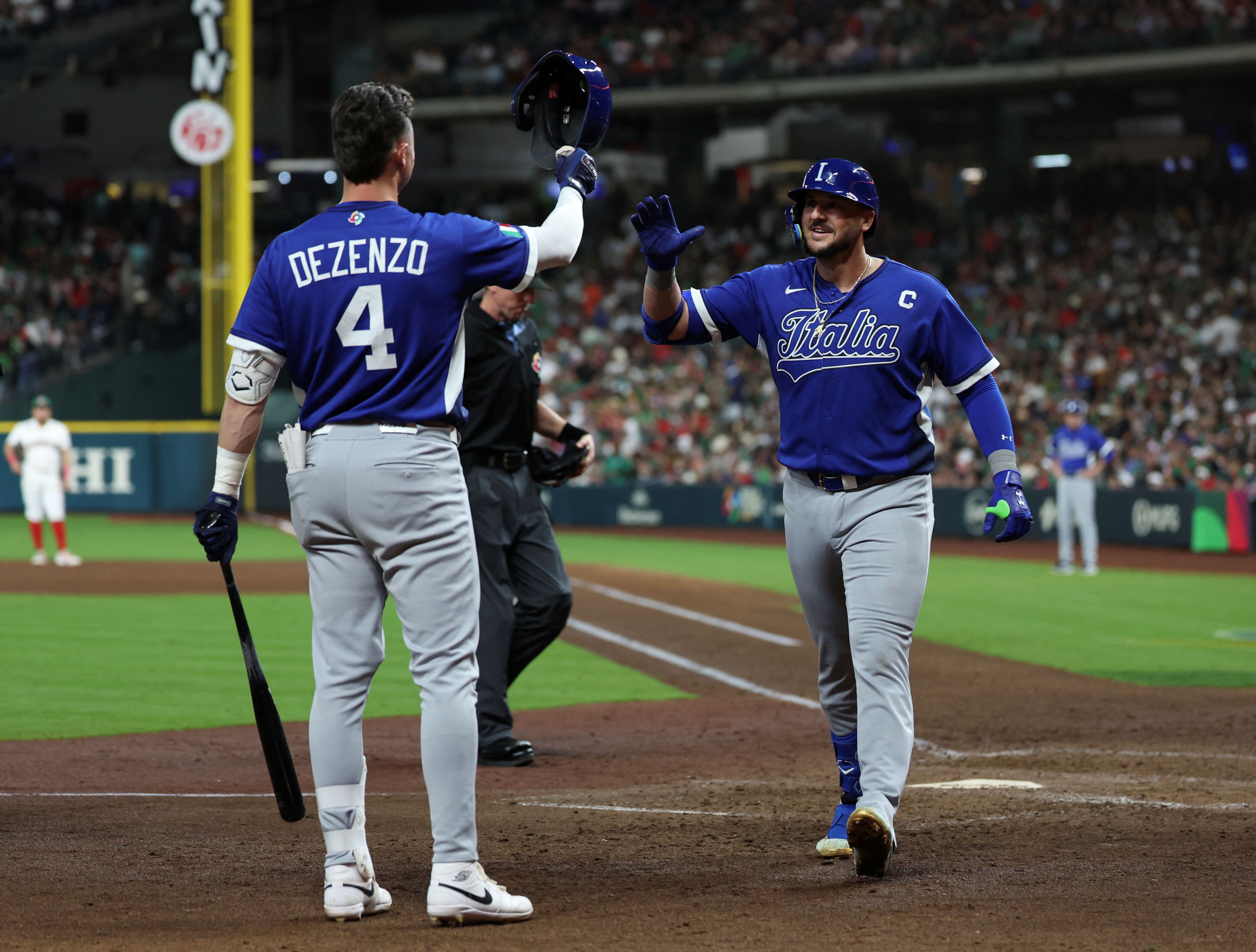 Italy first baseman Vinnie Pasquantino reacts after hitting a home run, and he's featured as part of our Italy vs. Puerto Rico predictions.