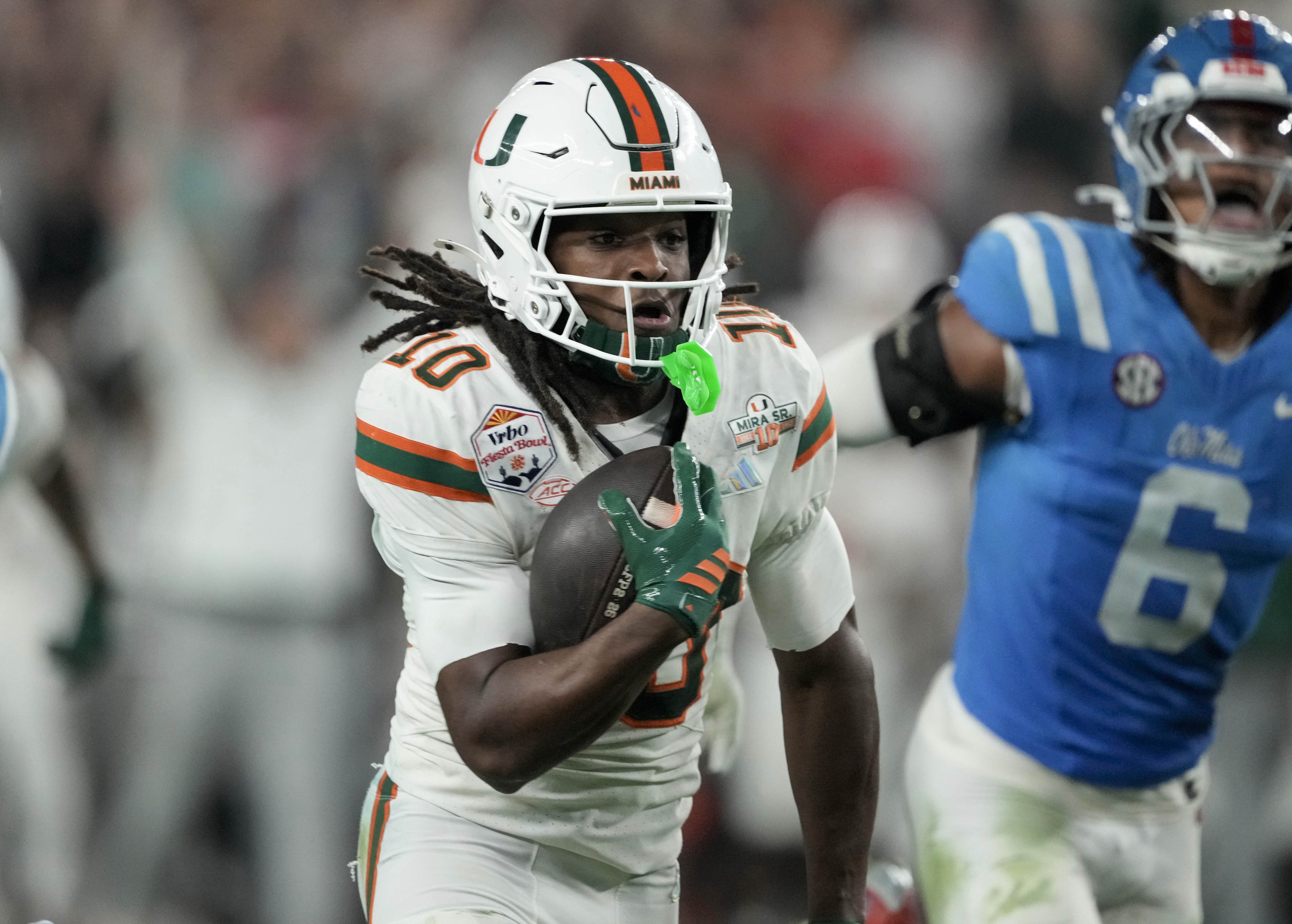 Miami wide receiver Malachi Toney (10) carries the ball as we offer our anytime touchdown scorer predictions for Miami vs. Indiana.