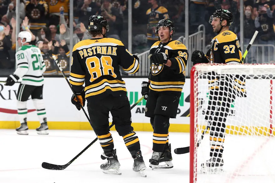 Brad Marchand of the Boston Bruins celebrates with Patrice Bergeron and David Pastrnak after scoring a goal against the Dallas Stars at TD Garden in Boston, Massachusetts. Photo by Maddie Meyer Getty Images via AFP.