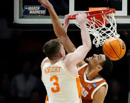 Dalton Knecht of the Tennessee Volunteers dunks the ball against Dylan Disu of the Texas Longhorns during the the second round of the NCAA Men's Basketball Tournament. We're backing Knecht in our March Madness player props and best bets.
