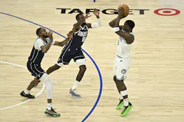 Anthony Edwards of the Minnesota Timberwolves shoots the ball against Tim Hardaway Jr. of the Dallas Mavericks during Game 1 of the Western Conference Finals. We're backing Edwards in our Mavericks vs. Timberwolves parlay.