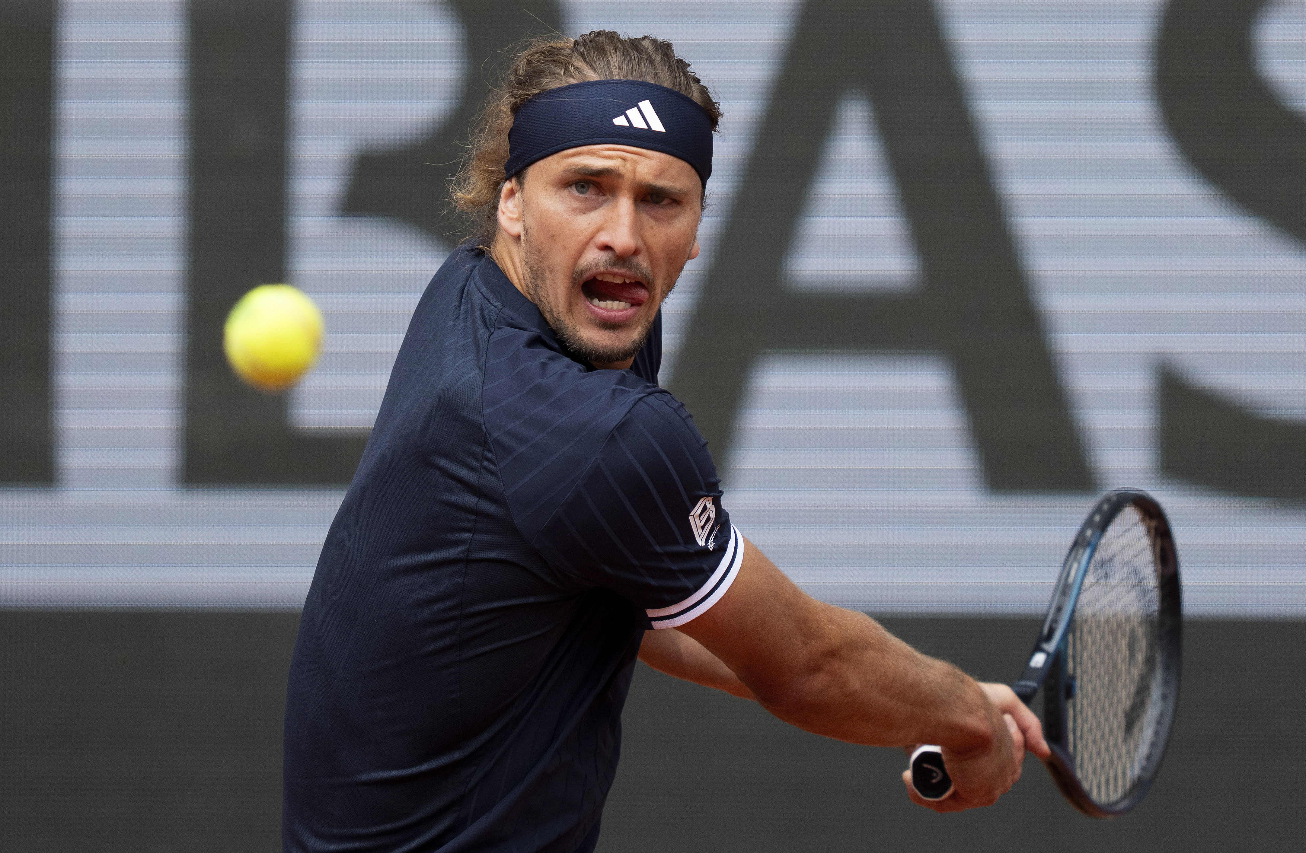 Alexander Zverev of Germany, seen here returning a shot during a match, is featured in our Cobolli vs. Zverev prediction.