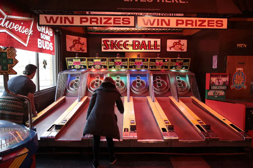 Customers play arcade games as we look at Illinois lawmakers pushback on the Dave & Buster's plan to allow gambling on arcade games