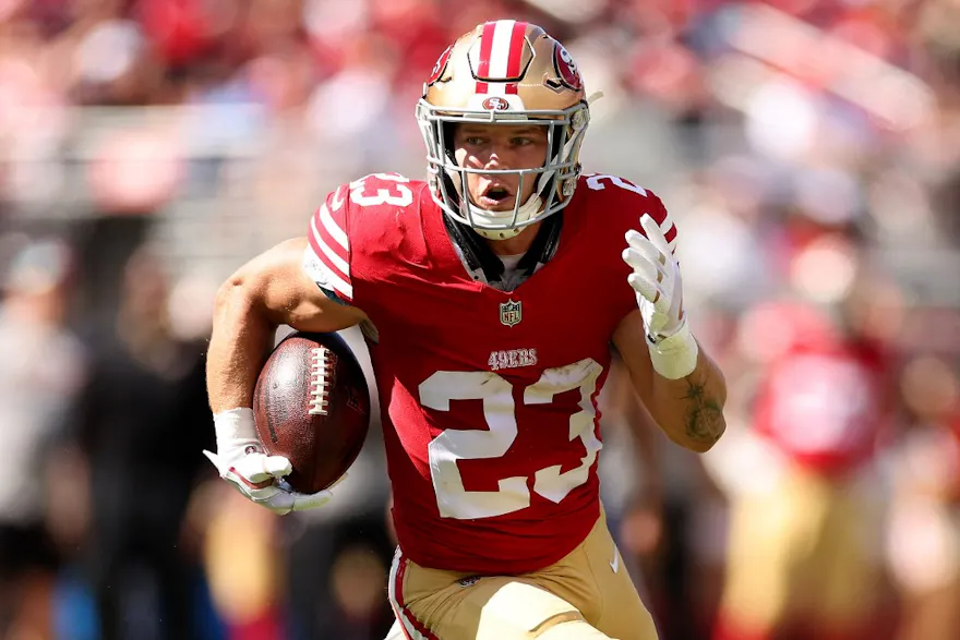 Christian McCaffrey of the San Francisco 49ers runs with the ball against the Arizona Cardinals as we look at what Super Bowl records might be broken this year.
