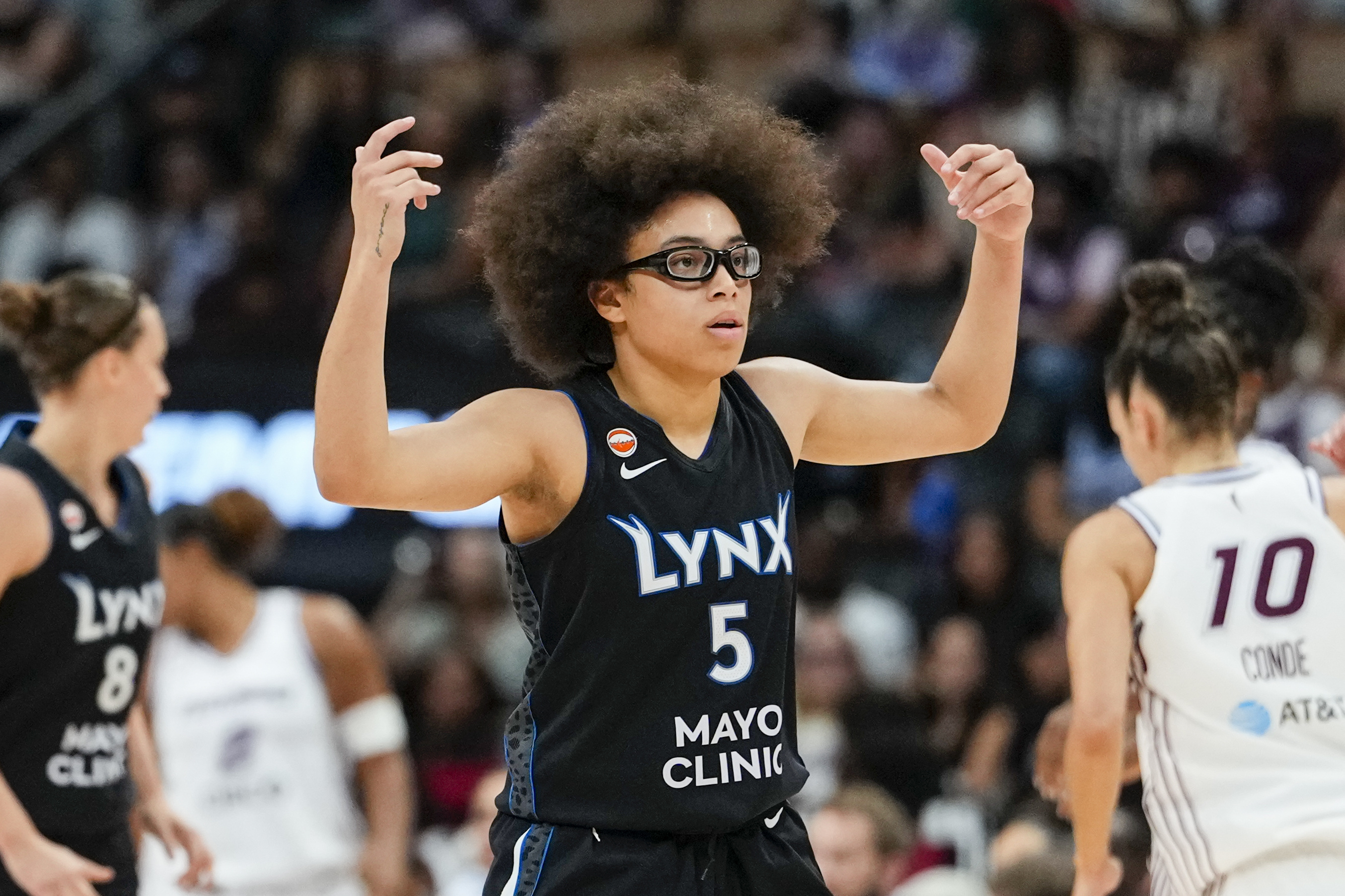 Minnesota Lynx guard Olivia Miles (5) celebrates as she is featured on our Fever vs. Lynx prediction.