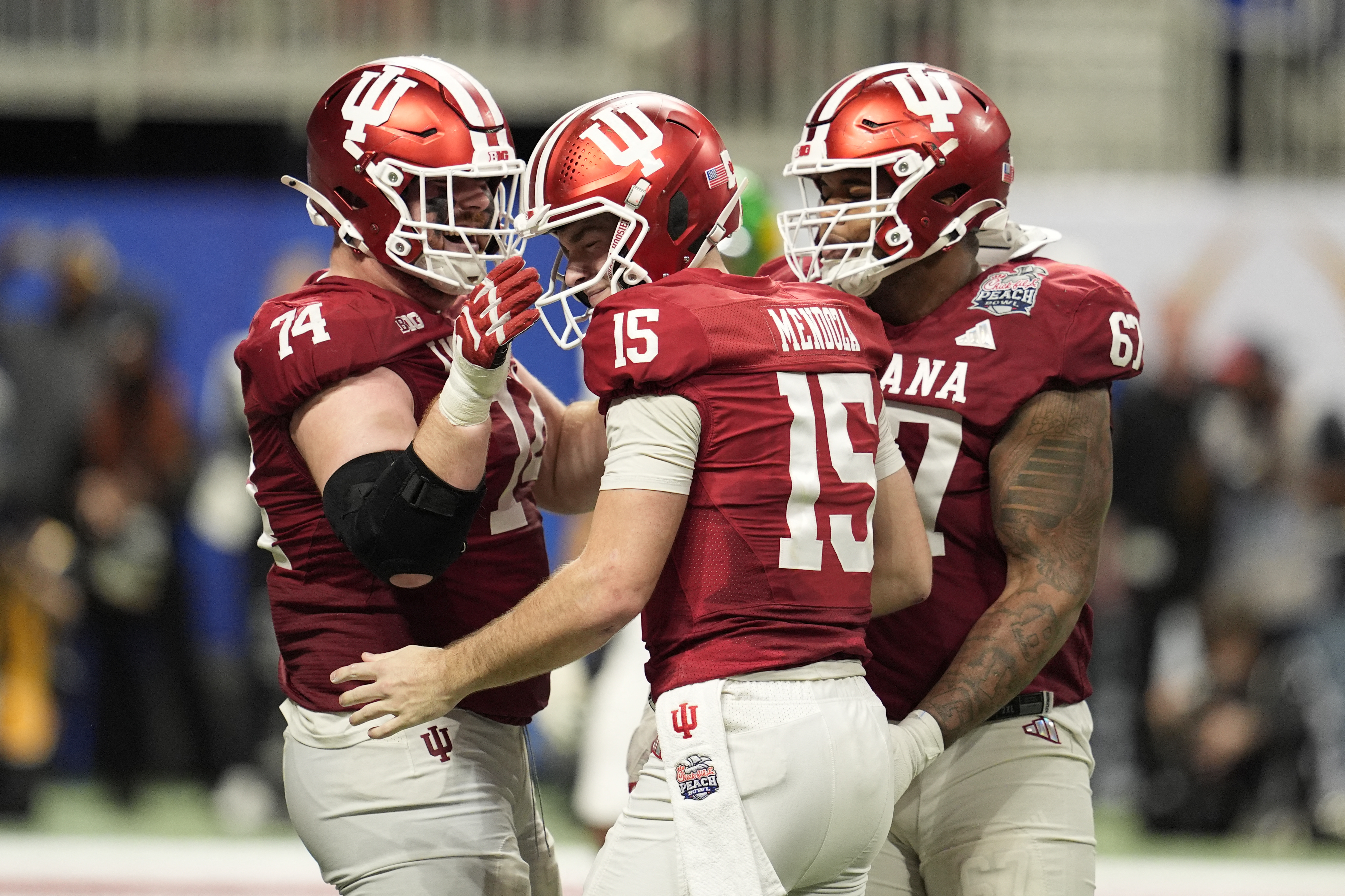 Indiana Hoosiers quarterback Fernando Mendoza (15) celebrates with Indiana Hoosiers offensive lineman Bray Lynch (74) after a touchdown as we break down how Indiana will win the CFP National Championship.