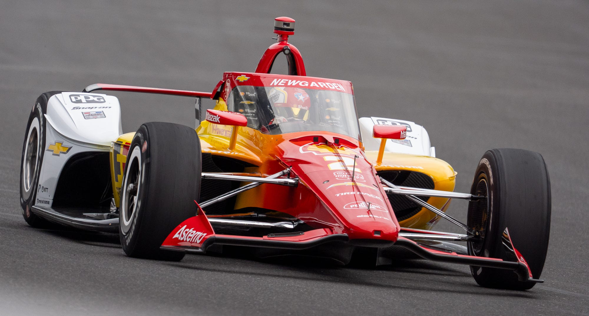 Team Penske driver Josef Newgarden (2) heads into turn one Friday, May 22, 2026, on Carb Day ahead of the 110th running of the Indianapolis 500 at Indianapolis Motor Speedway.