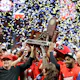 Head coach Kirby Smart of the Georgia Bulldogs celebrate with the trophy after defeating the LSU Tigers in the SEC Championship game at Mercedes-Benz Stadium in Atlanta, Georgia. Kevin C. Cox/Getty Images via AFP.