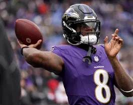 Lamar Jackson of the Baltimore Ravens warms up prior to the AFC Championship Game against the Kansas City Chiefs as we look at our 2024 NFL win total odds.