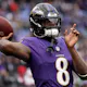 Lamar Jackson of the Baltimore Ravens warms up prior to the AFC Championship Game against the Kansas City Chiefs as we look at our 2024 NFL win total odds.