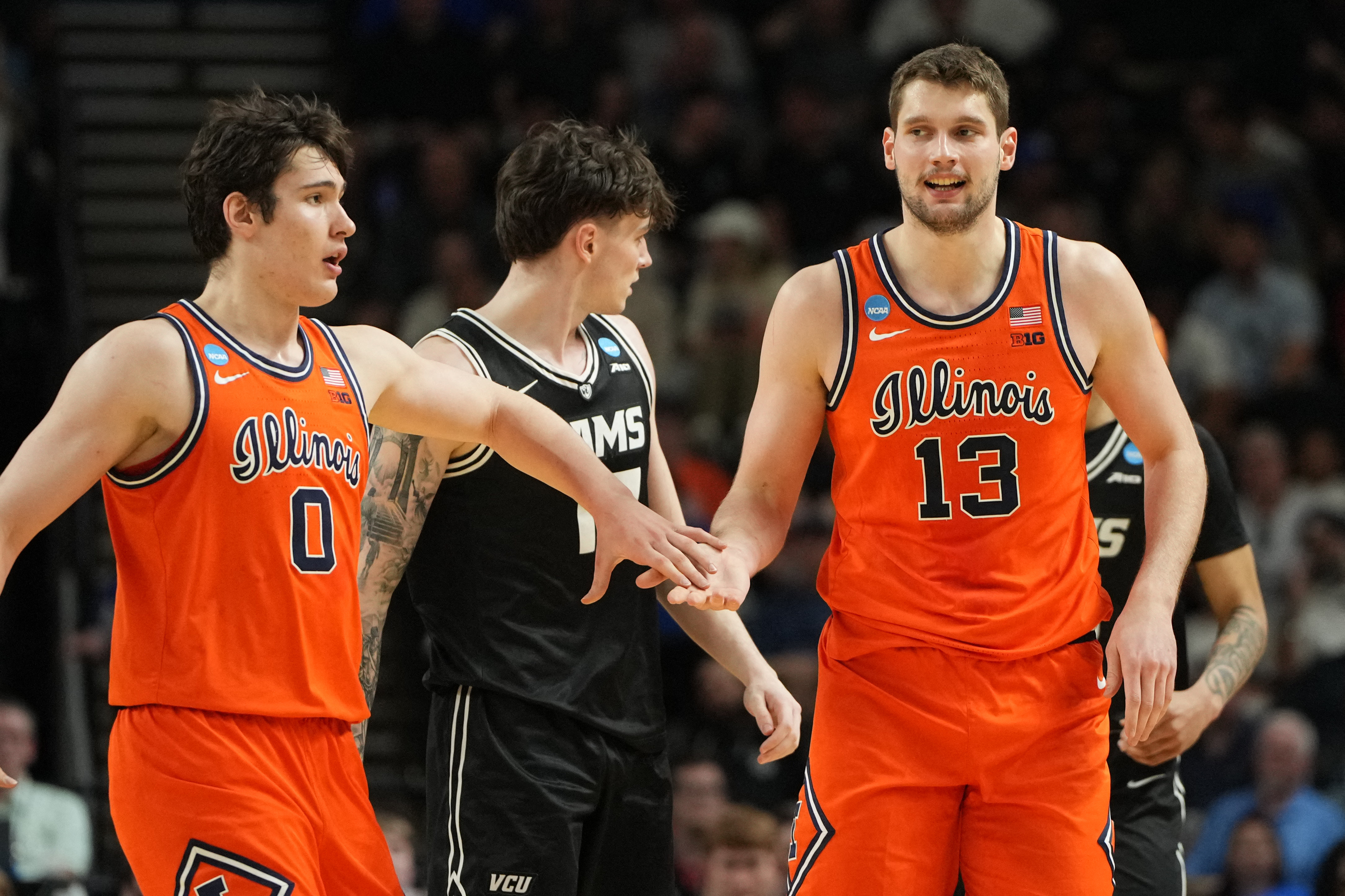 Illinois Fighting Illini forward David Mirkovic (0) and center Tomislav Ivisic (13), featured in our Illinois vs. Houston prediction, react after a play.