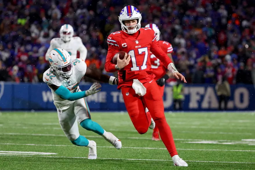 Josh Allen #17 of the Buffalo Bills carries the ball against the Miami Dolphins during the fourth quarter at Highmark Stadium on Dec. 17, 2022.