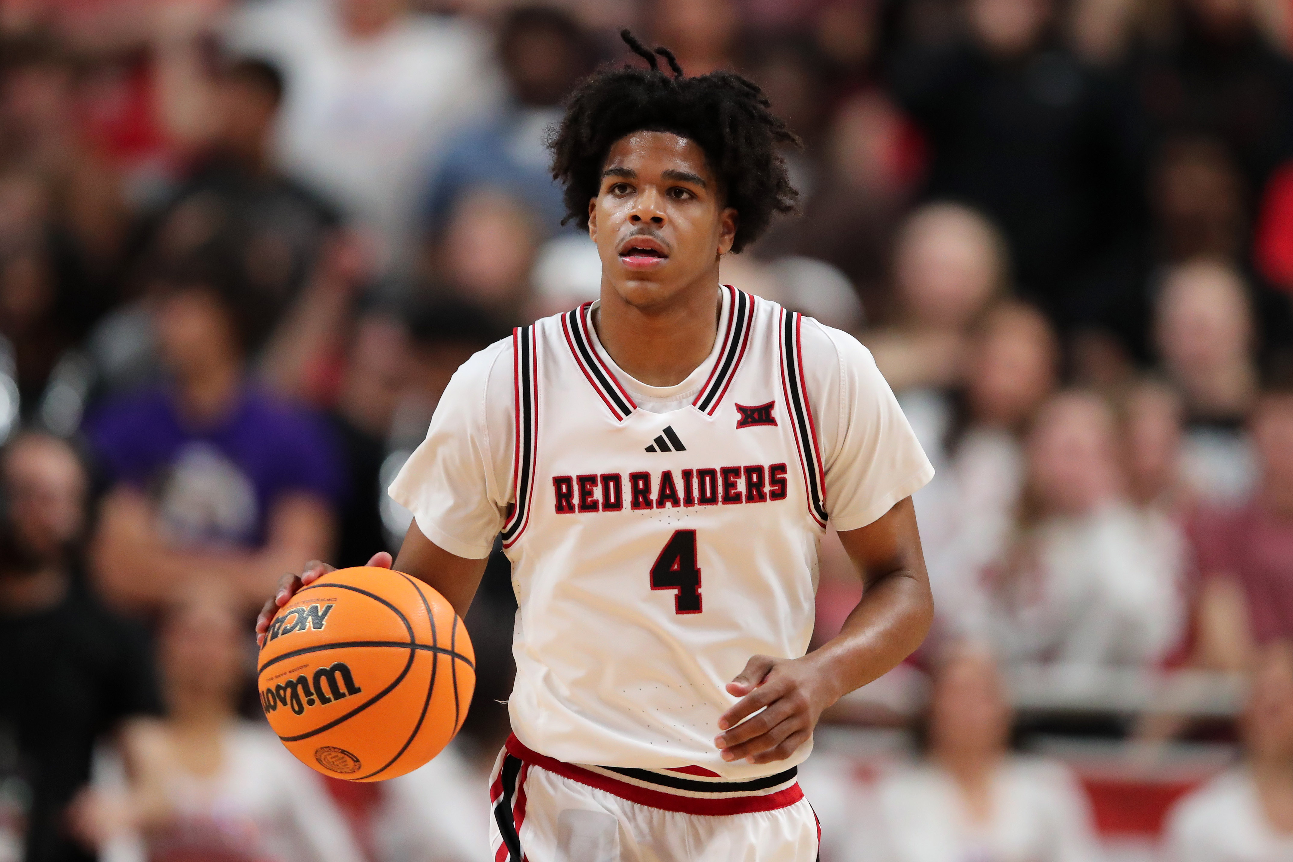 Texas Tech Red Raiders guard Christian Anderson (4) dribbles as we break down our Akron vs. Texas Tech prediction.