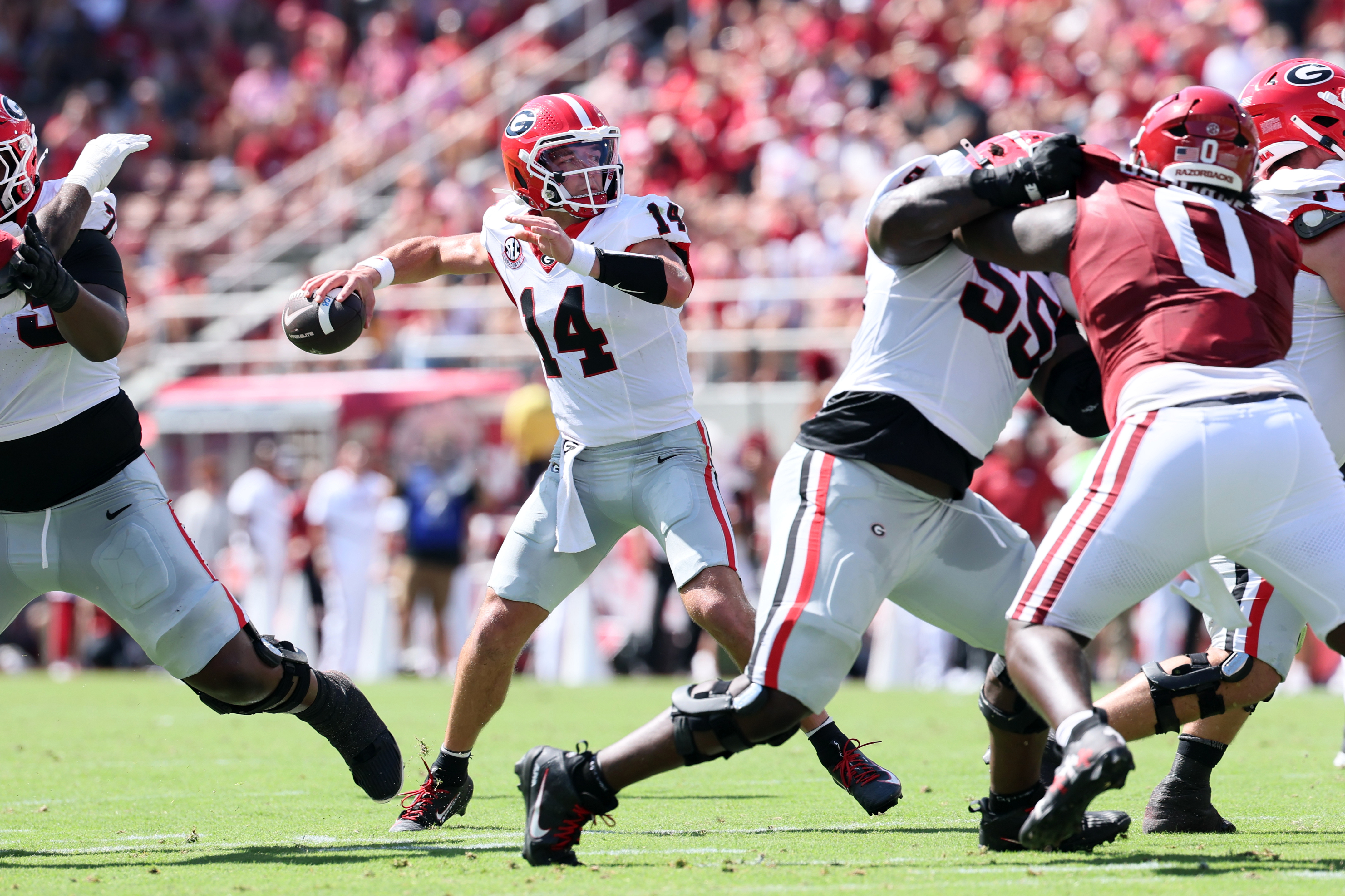 Pictured: Bulldogs quarterback Gunner Stockton throwing a pass as we break down our Oklahoma vs. Georgia Prediction. Photo by Nelson Chenault-Imagn Images.