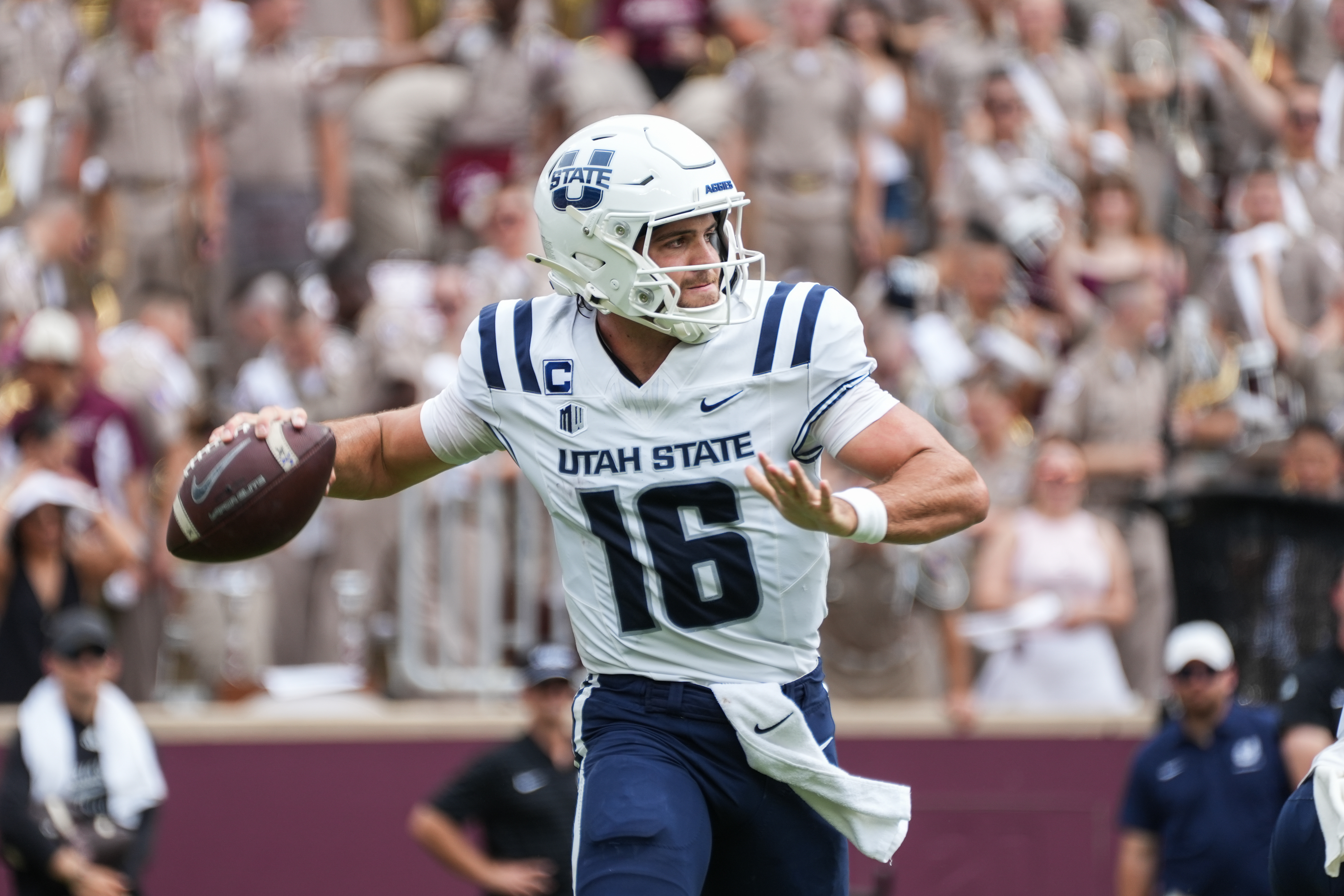 Utah State quarterback Bryson Barnes (16) throws a pass as we offer our Washington State vs. Utah State predictions for the Famous Idaho Potato Bowl.