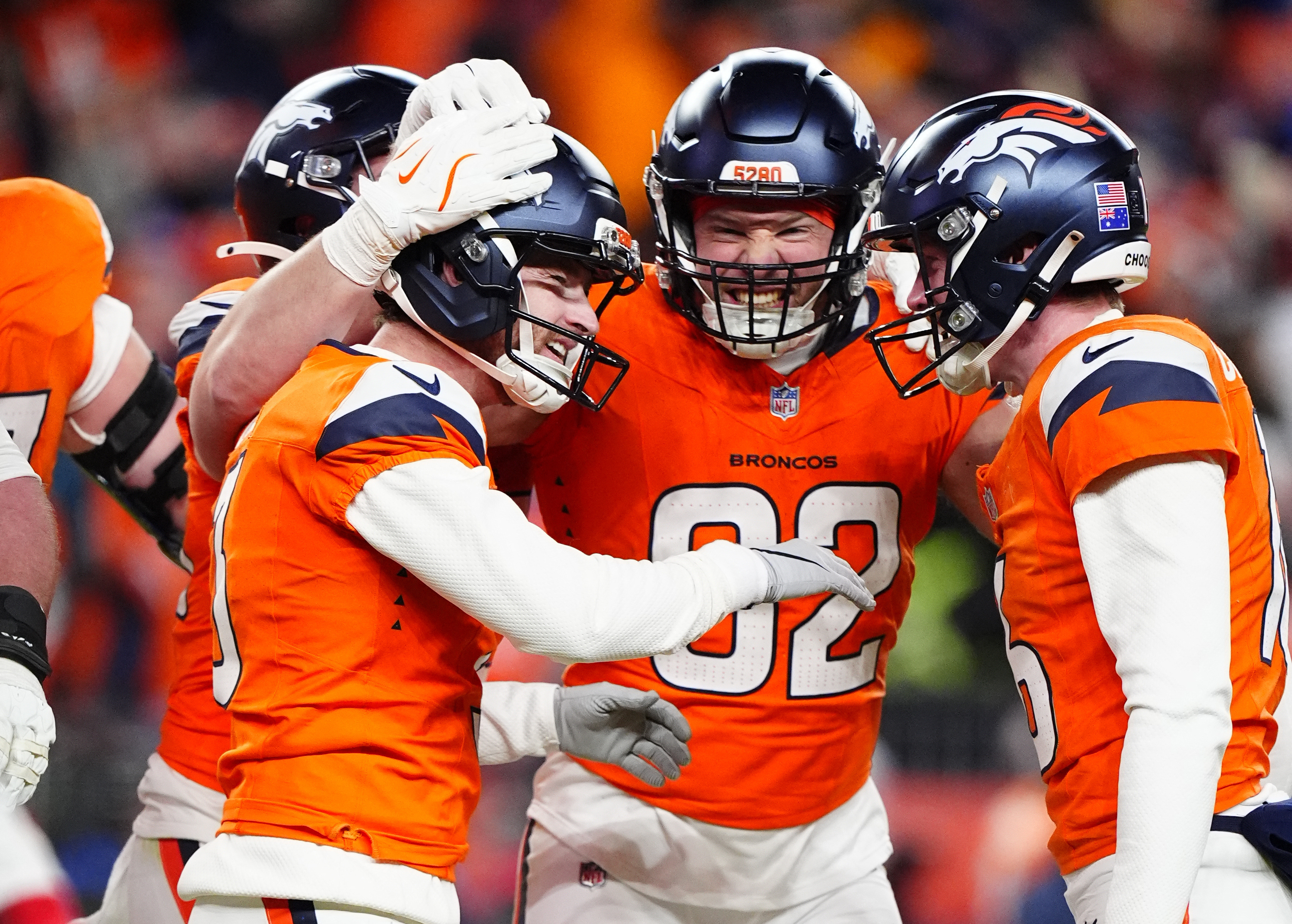 Denver Broncos place kicker Wil Lutz (3) celebrates with tight end Adam Trautman (82) and punter Jeremy Crawshaw (16) after kicking a game-winning field goal as we look at our AFC Championship Game Squares contest