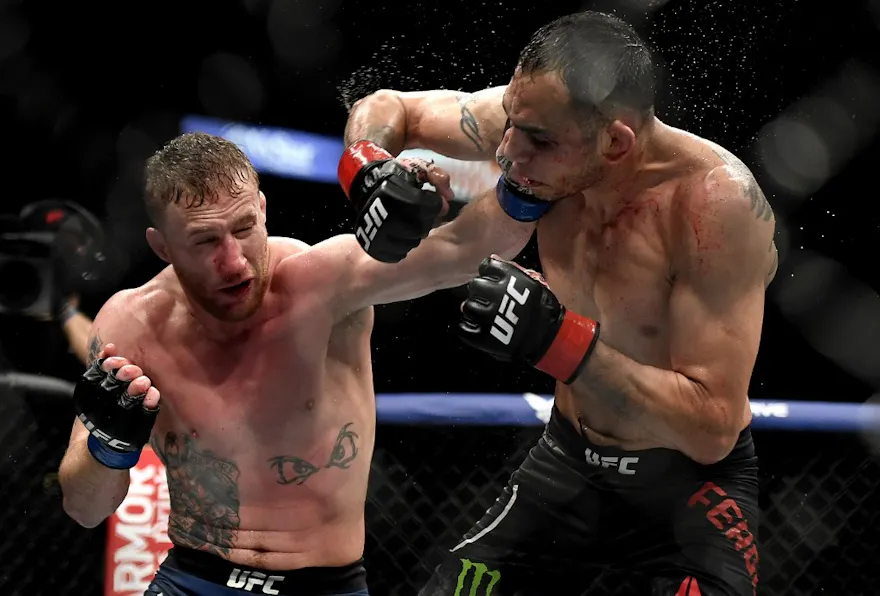 Justin Gaethje (L) of the United States punches Tony Ferguson as we look at our bet365 bonus code for Poirier vs. Gaethje