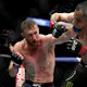 Justin Gaethje (L) of the United States punches Tony Ferguson as we look at our bet365 bonus code for Poirier vs. Gaethje