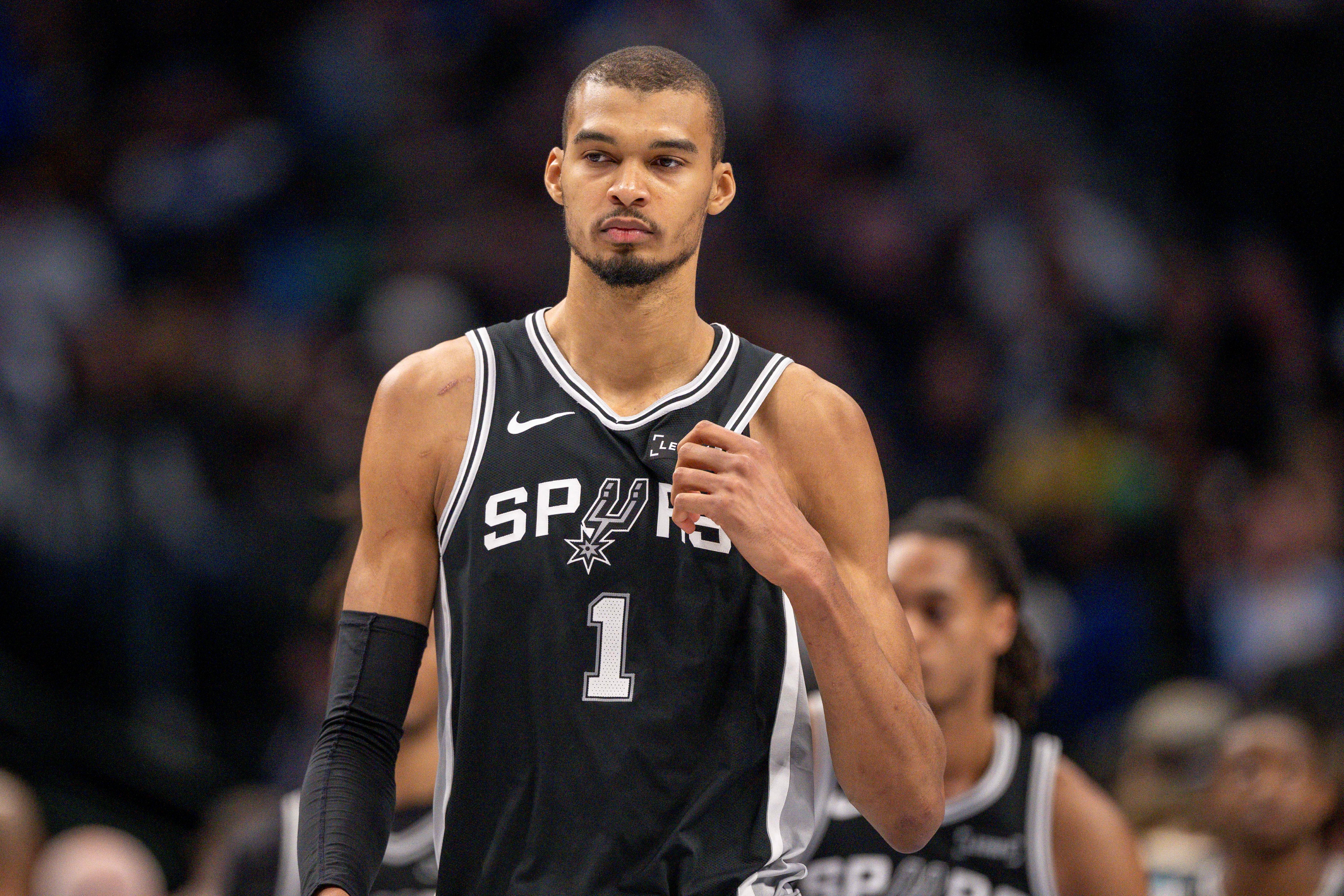San Antonio Spurs forward Victor Wembanyama (1) looks on as we break down our Spurs vs. Heat player props tonight.