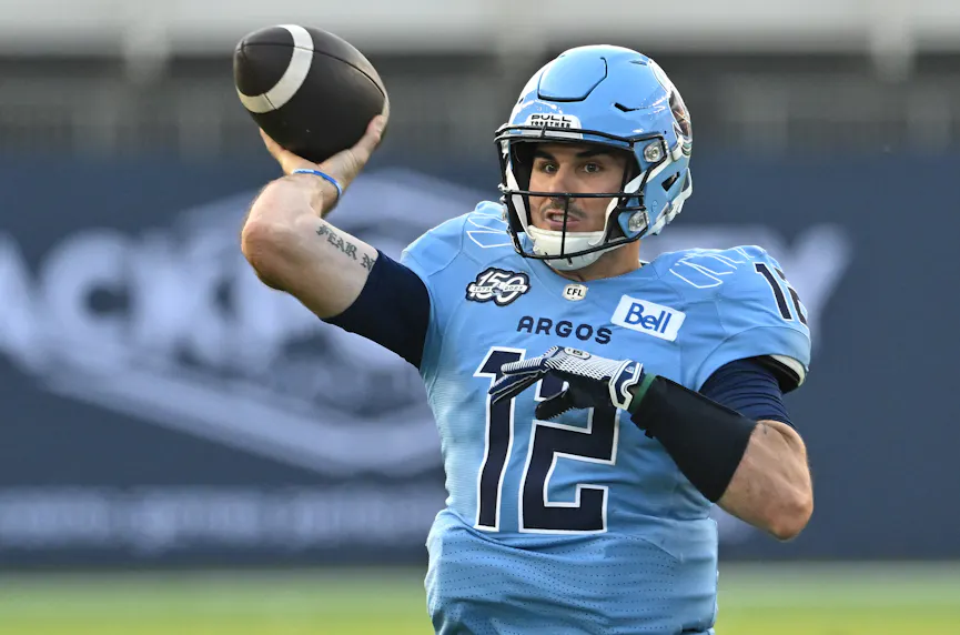 Toronto Argonauts quarterback Chad Kelly throws a pass against the Hamilton Tiger-Cats. We're backing Kelly in his return as part of our Roughriders vs. Argonauts prediction.