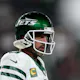 Aaron Rodgers #8 of the New York Jets warms up as we look ahead to the 2024-25 NFL Comeback Player of the Year odds, with Rodgers among the likely favorites entering the 2024 NFL season.