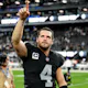 Derek Carr of the Las Vegas Raiders points to the crowd after the Raiders beat Los Angeles Chargers 27-20 at Allegiant Stadium.