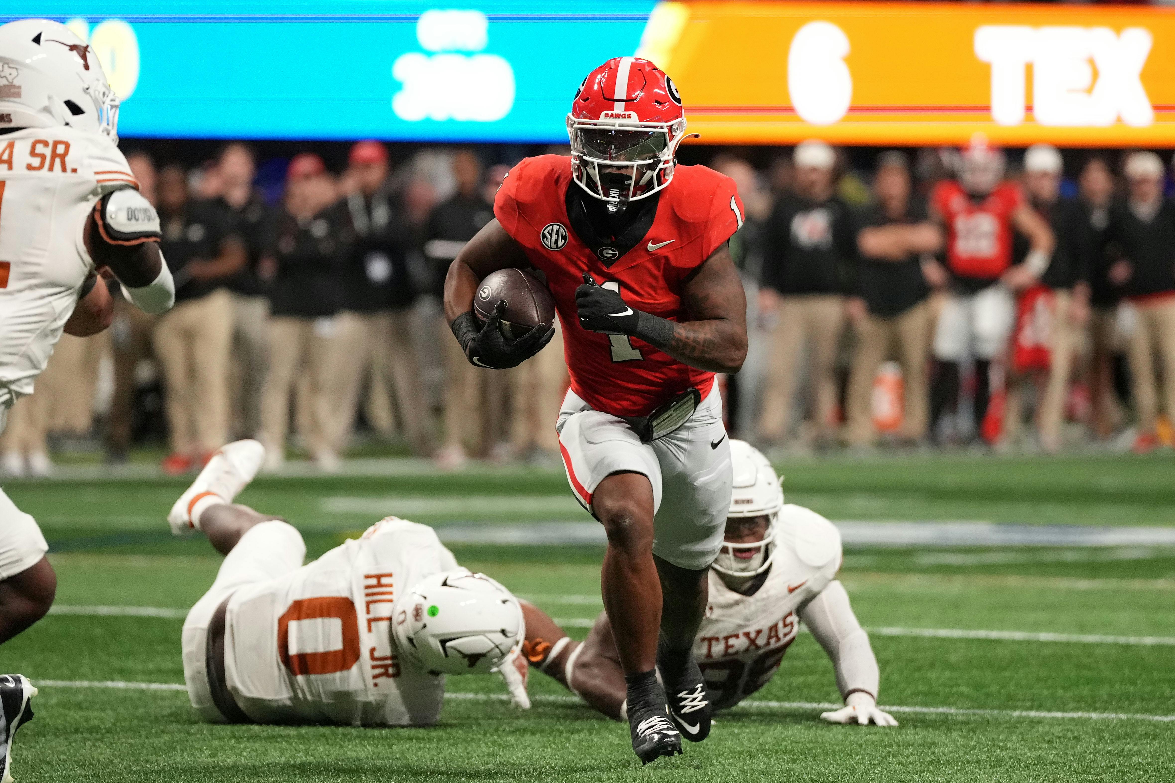 Georgia running back Trevor Etienne rushes for a touchdown against Texas. The Bulldogs have the second-shortest college football championship odds.