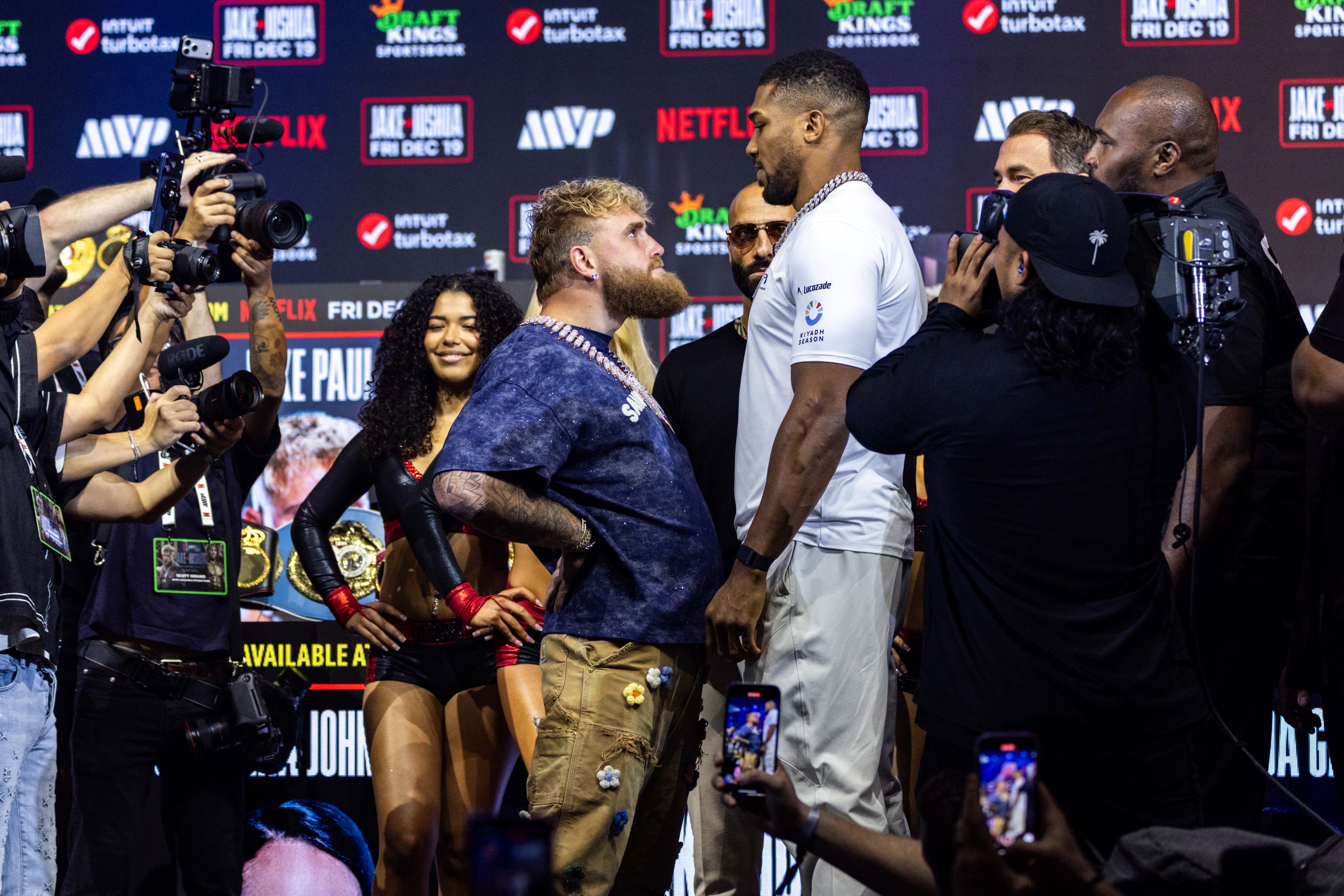 Jake Paul and Anthony Joshua face each other during the press conference for the upcoming Jake Paul vs Anthony Joshua boxing match on Netflix as we look at the Jake Paul vs. Anthony Joshua betting odds